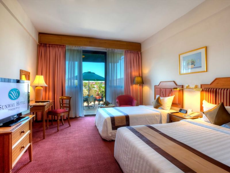 Wall-mounted water dispenser with a bottle in Deluxe Plus Twin at Sunway Hotel Big Box