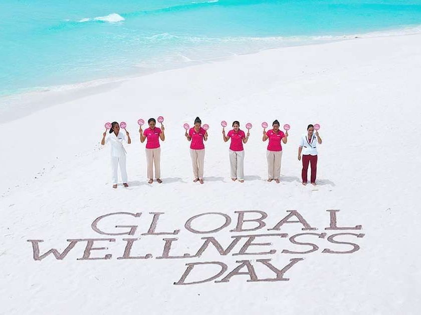 The Signature Collection staff posing for Global Wellness Day