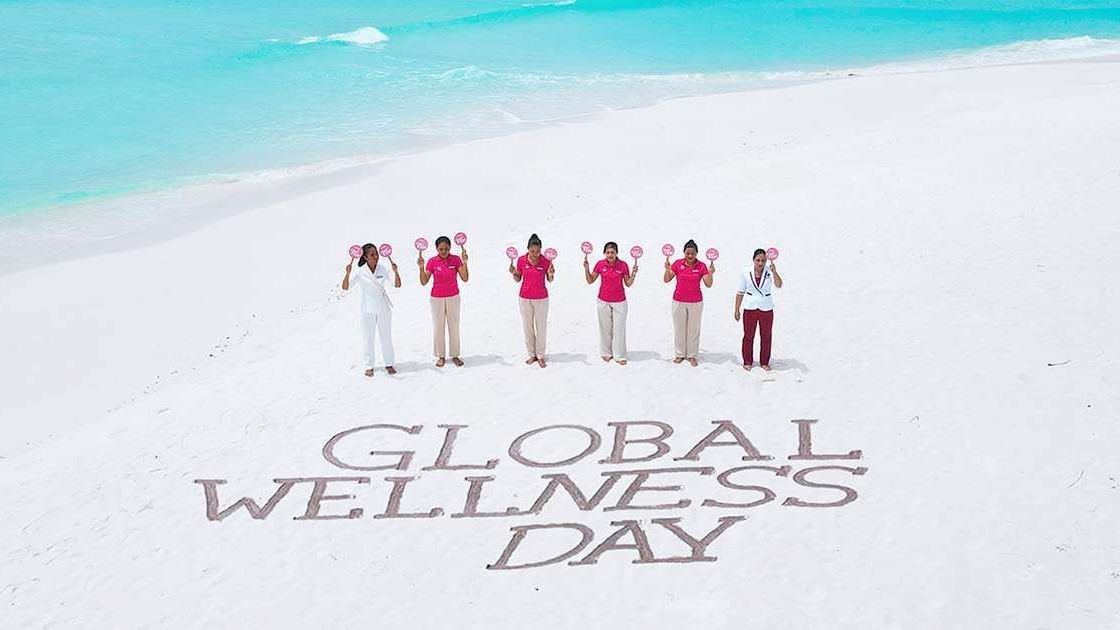 The Signature Collection staff posing for Global Wellness Day