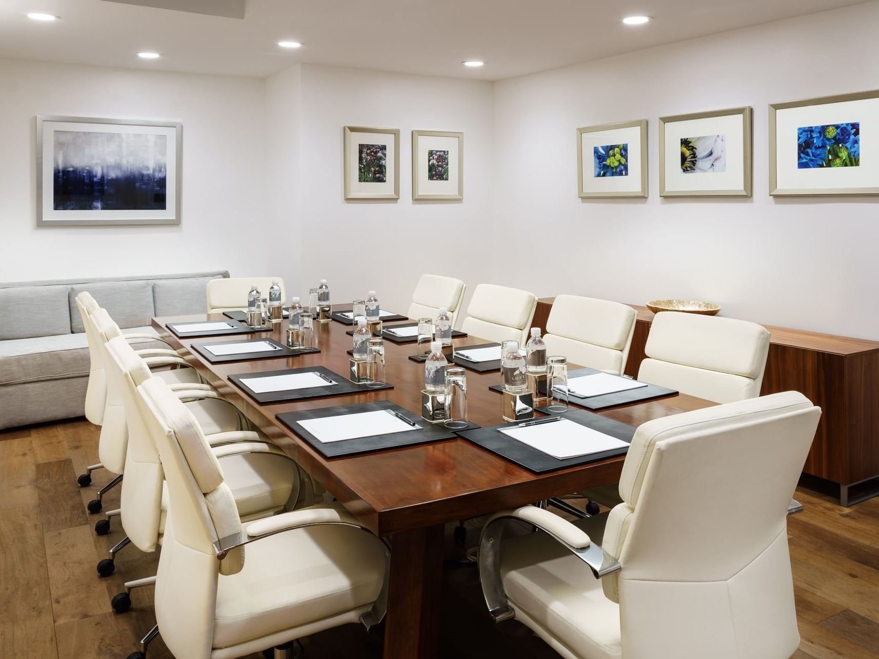 Conference set-up with cozy sofas in Palisades Board Room at Luxe Sunset Boulevard Hotel