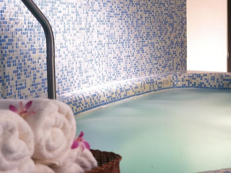 Indoor pool and rolled towels at Live Aqua Beach Resort Cancun
