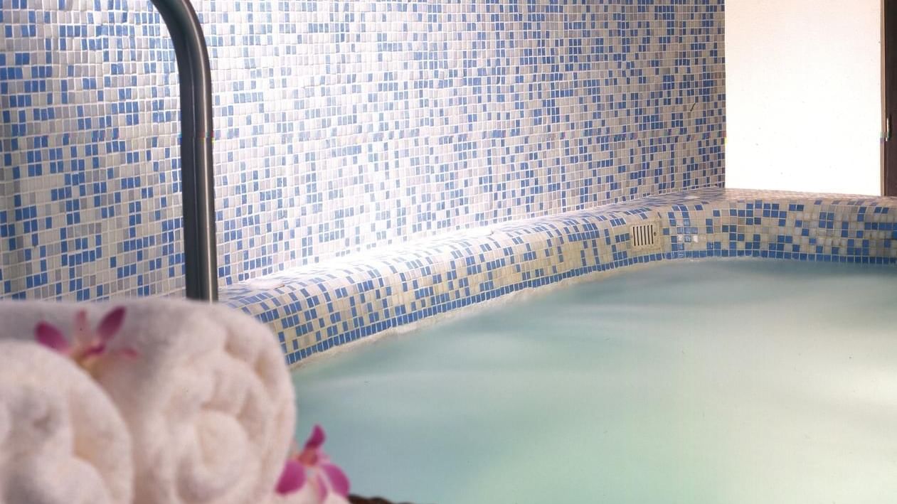 Indoor pool and rolled towels at Live Aqua Beach Resort Cancun
