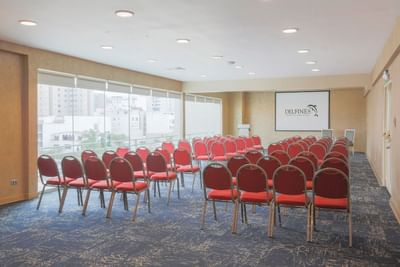 Theater setup with carpeted flooring and a city view in the Atlantis Room at Hotel Los Delfines & Casino