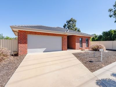 La Trobe University Regional Housing in Mildura with a driveway and fenced garden.