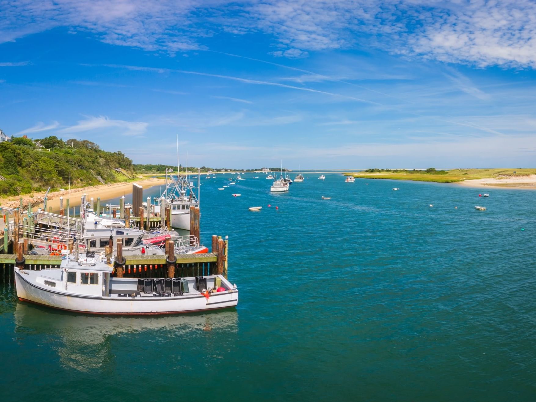 Panoramic view of boats parked by the dock in Chatham Fish Pier near Chatham Tides Resort