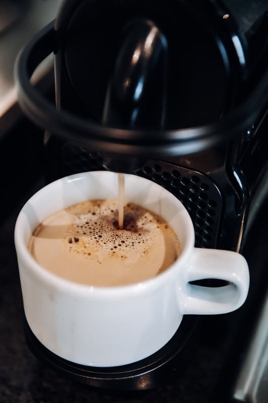 Pouring coffee from a coffee machine at Casa Mali by Dominion