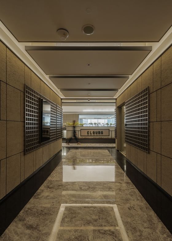 Modern hotel hallway with marble floors and 