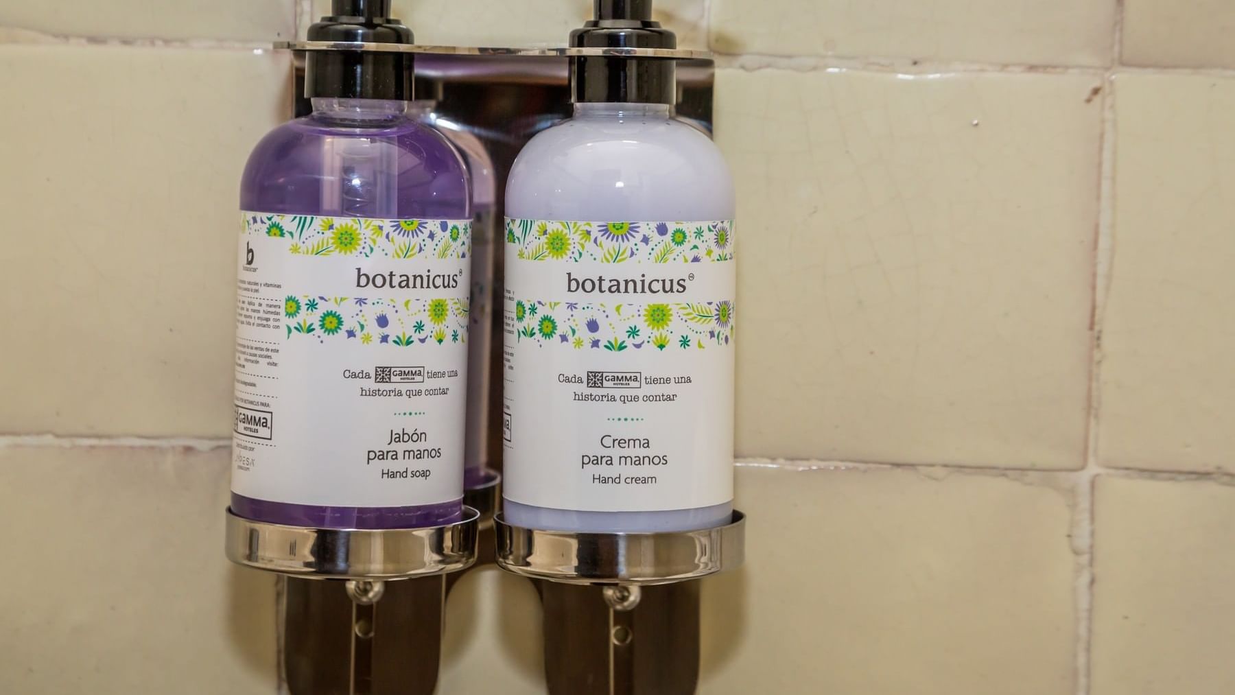 Close-up of hand soap & hand cream dispensers in a bathroom at Gamma Puebla Senorial Centro