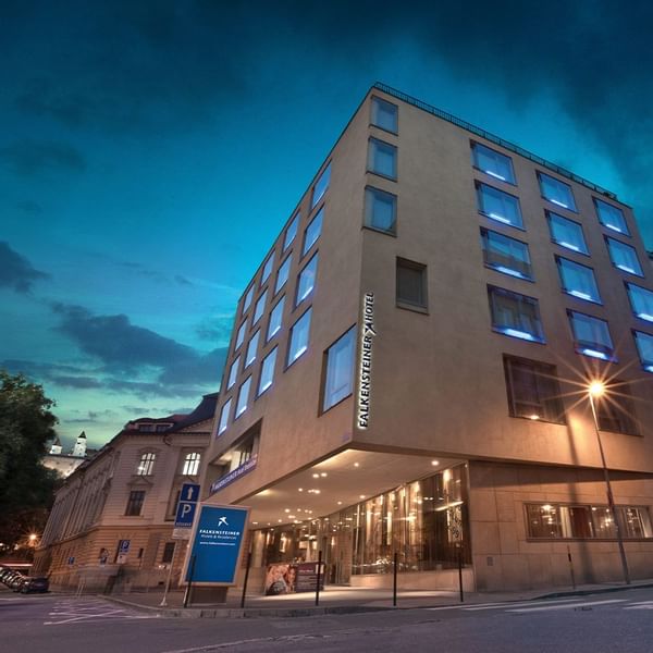 Falkensteiner Hotel Bratislava exterior at twilight with illuminated windows