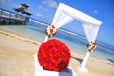 Wedding Arch & a posy on the beach by Holiday Inns Montego Bay