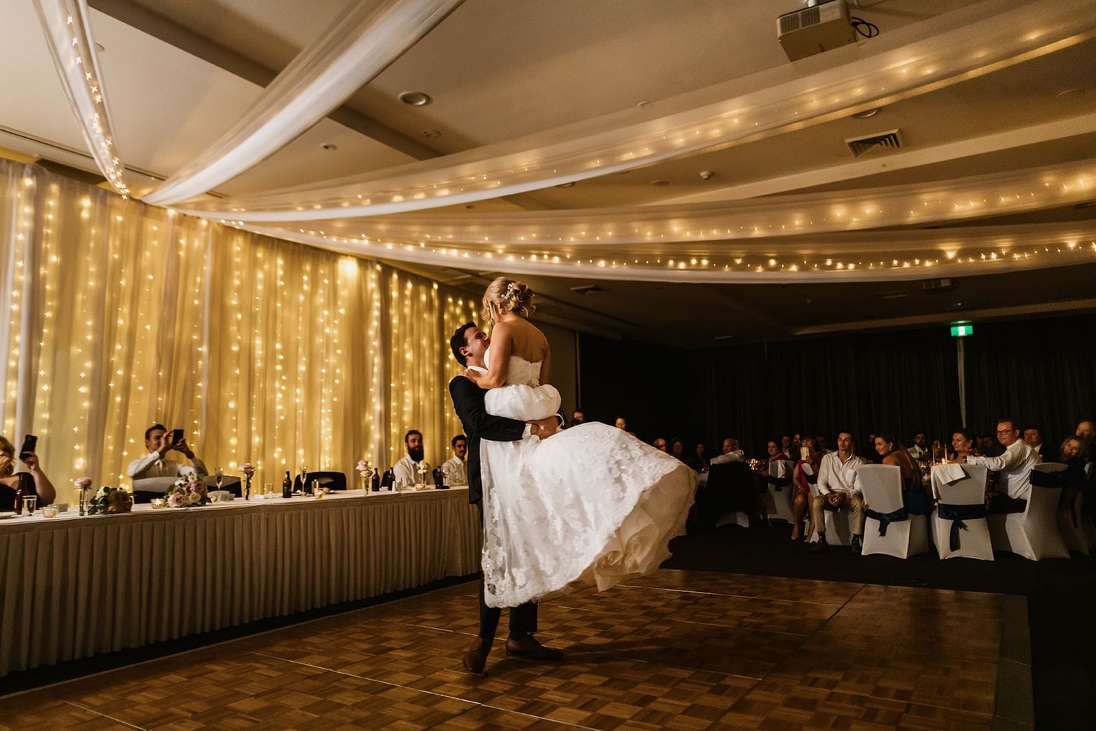 Bride and groom dancing in an wedding hall at Mercure Kooindah Waters