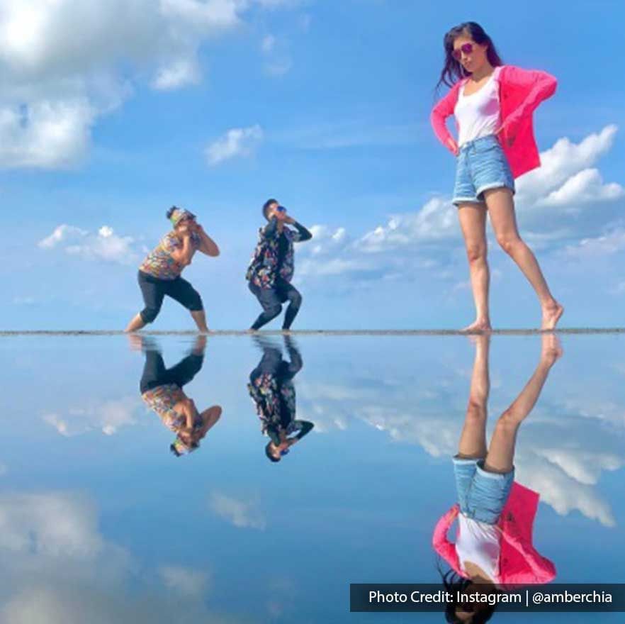 Tourists were striking creative poses at Bagan Datuk Sky Mirror - Lexis Suites Penang