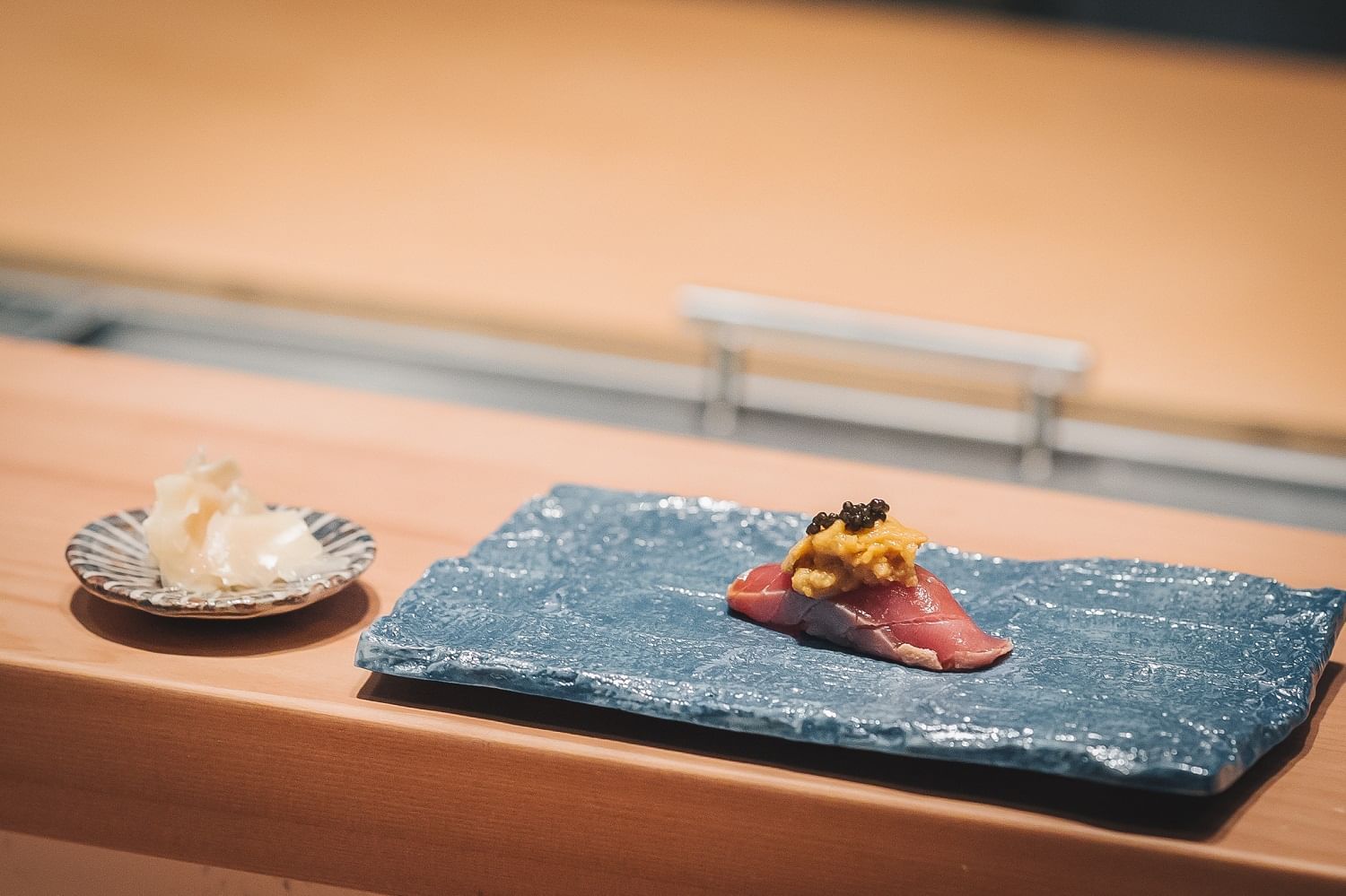 Close-up of a Foie gras nigiri food served at Okura Prestige