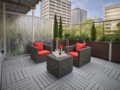 Outdoor lounge in a Premium King Room balcony at Matrix Hotel