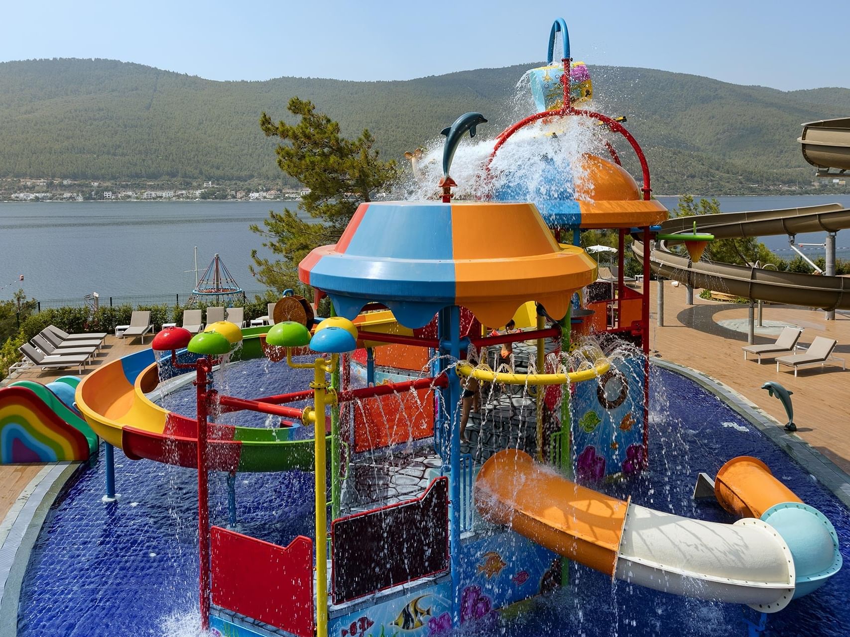 At Titanic Luxury Collection Bodrum, the sea-view water park features a kids' slide and a pool for playful moments.