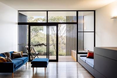 Living area with modern furniture in Lodge King at Freycinet Lodge