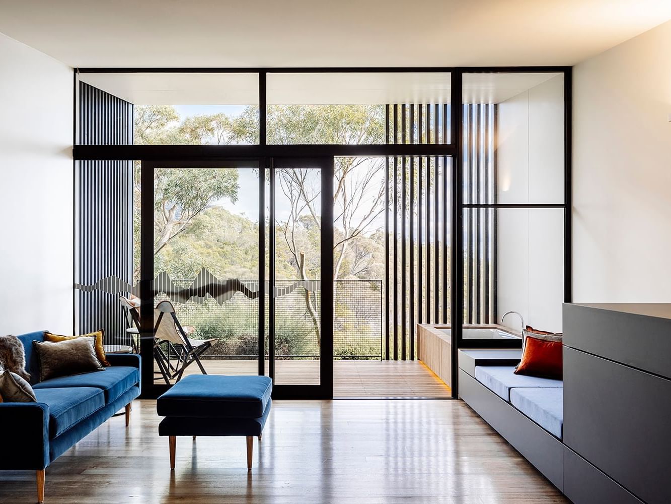 Lounge area of Lodge King room overlooking balcony at Freycinet Lodge