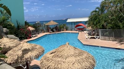 Swimming pool at Emerald Beach Resort, laid-back island escapes at a St. Thomas resort with pool facing the ocean