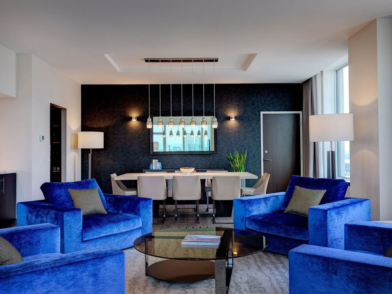 Dining and seating area with plush seatings in Bi-Level Penthouse Two Bedroom Suite at Hotel X Toronto