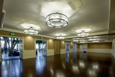 Interior of an empty ballroom with lights at Horton Grand Hotel