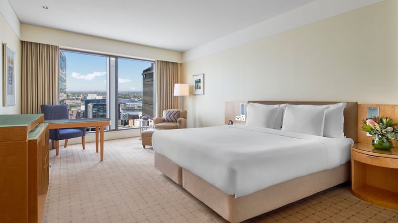 Executive Deluxe King Room with king bed ,workspace and side table at The Fullerton Hotel Sydney