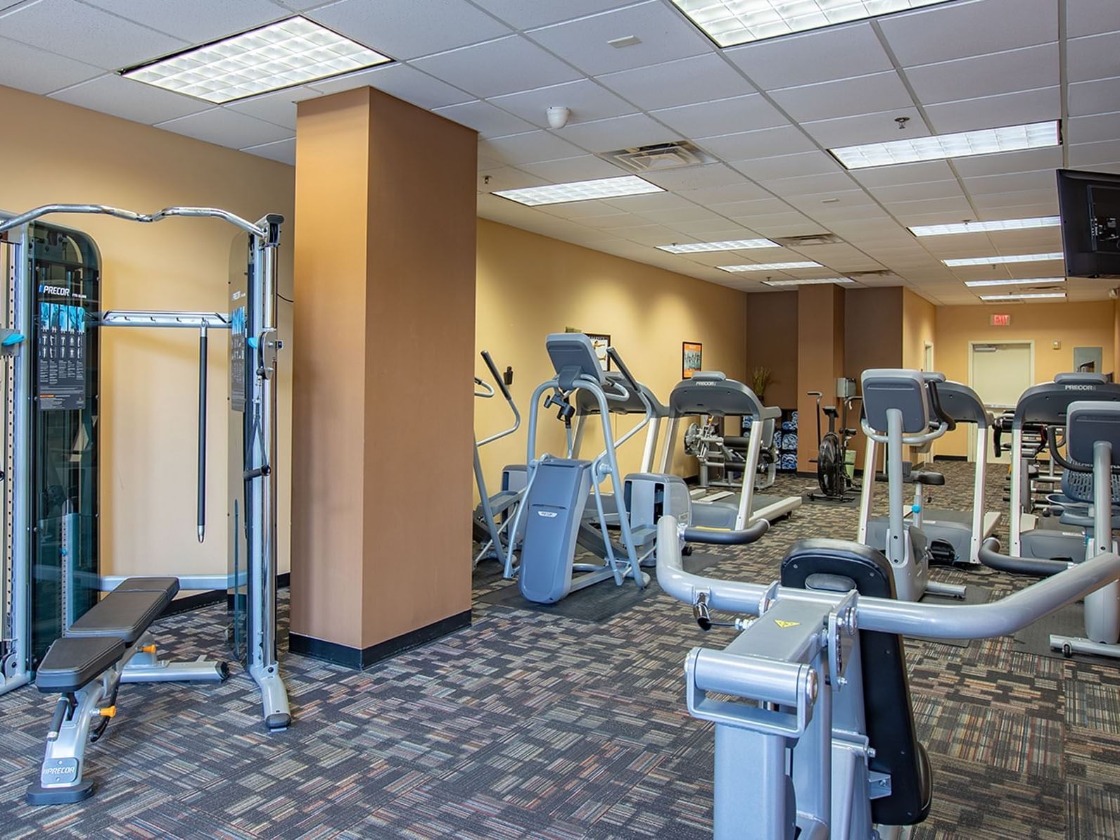A well-equipped gym with various exercise machines.