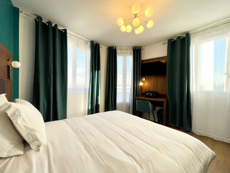 Room interior in Hotel Le Marignan at The Originals Hotels