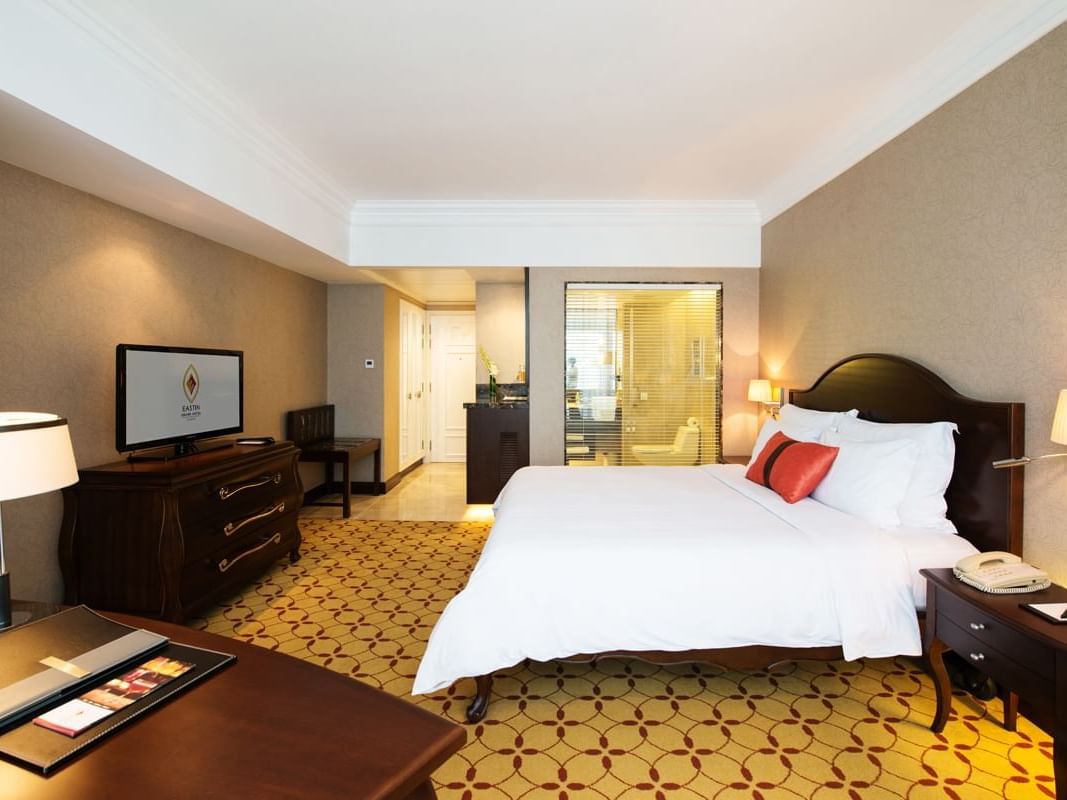 Deluxe Room with a king size bed & a TV at Eastin Grand Hotel Saigon