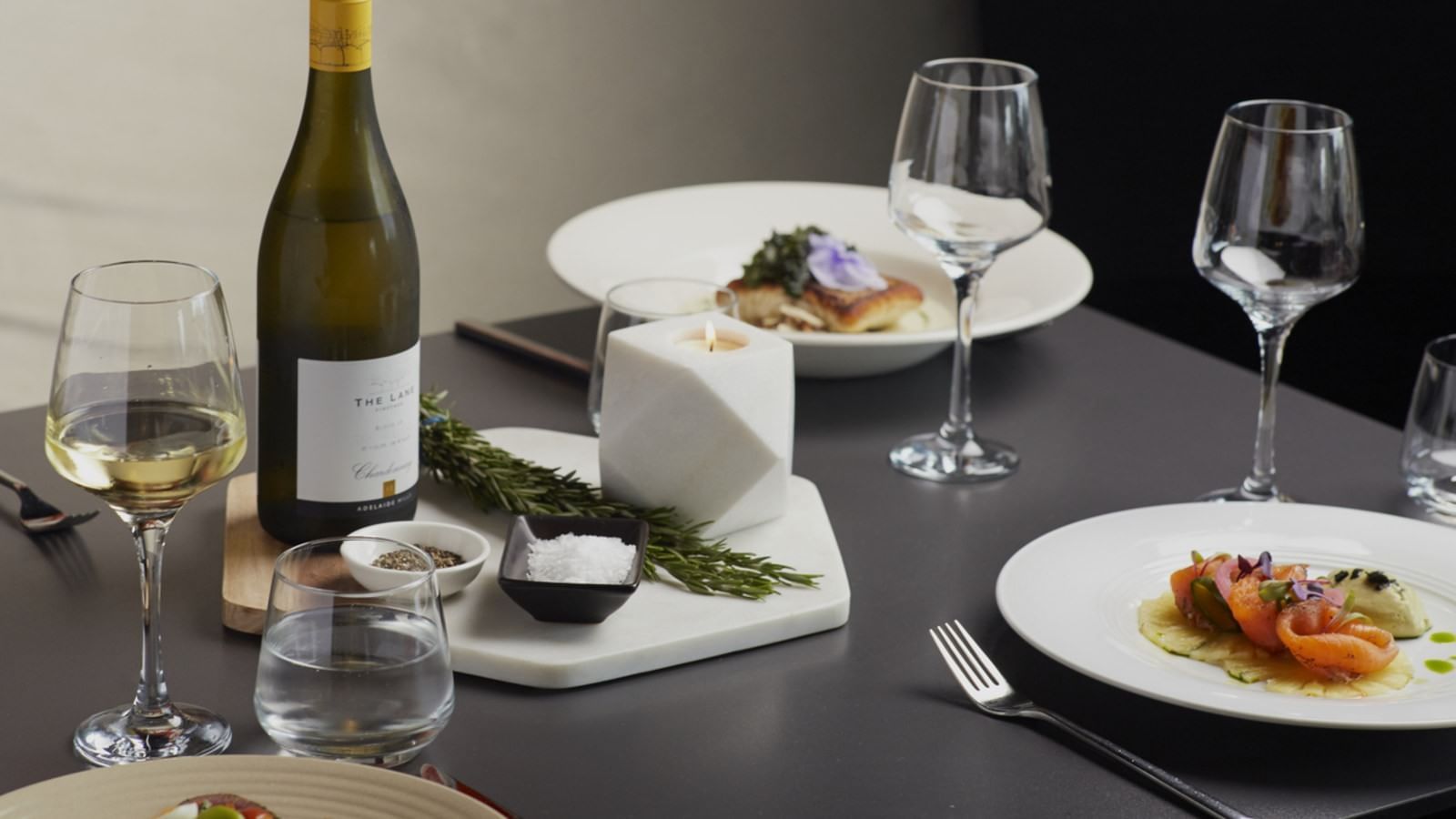 Meal plates and champagne glasses served at Pullman Albert Park