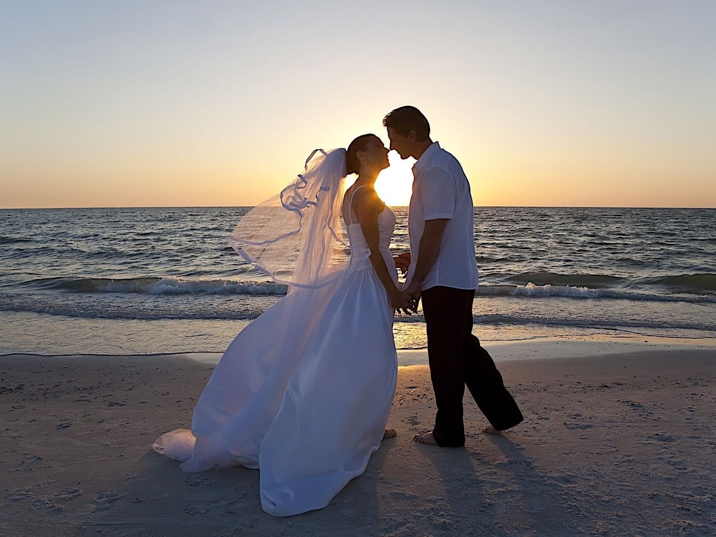 Couple at sunset on the beach near Princess Mundo Imperial