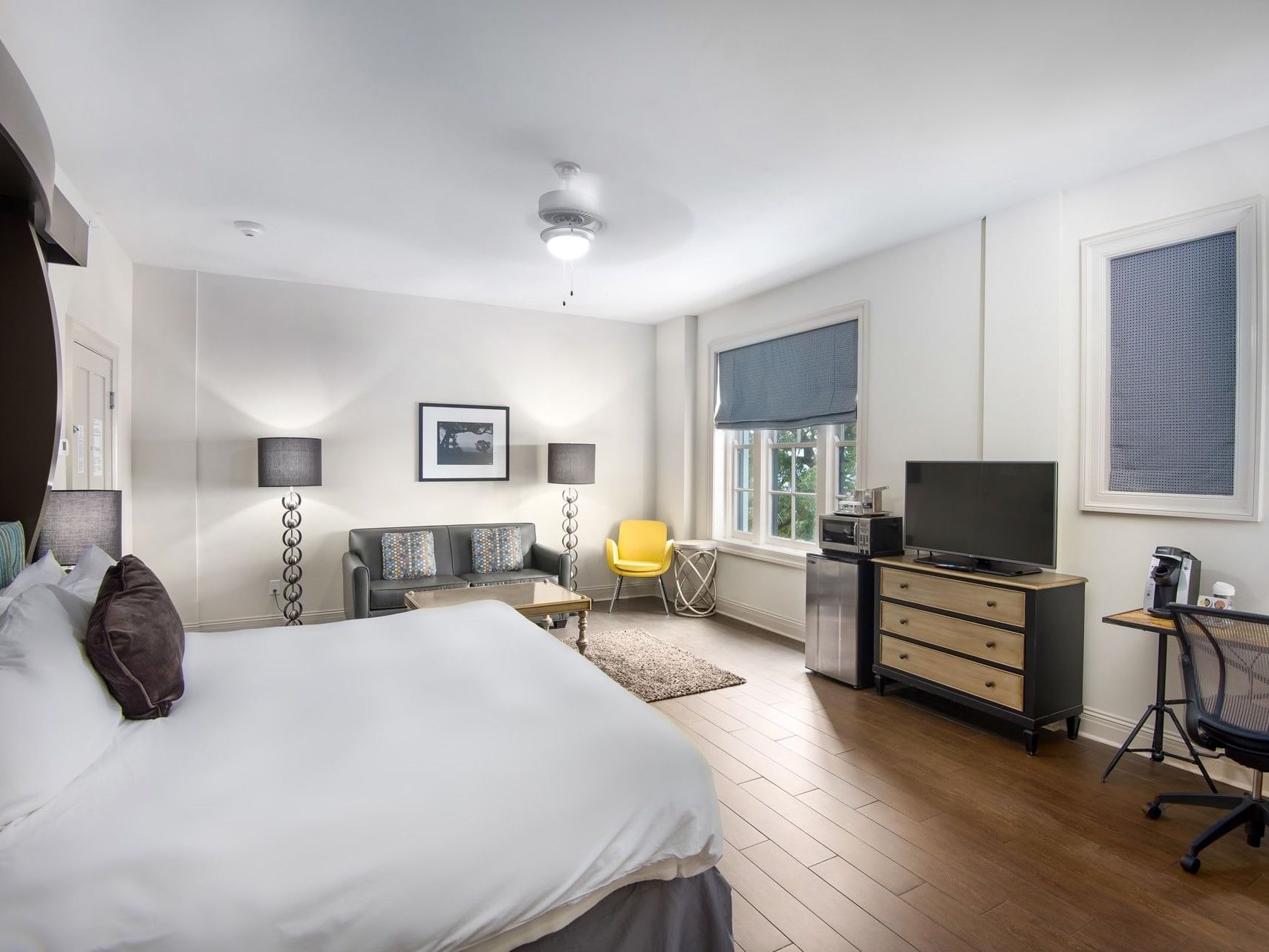 Suite King Bed Residential View, with a large bed, textured rug, and a desk with a chair at The White House Hotel