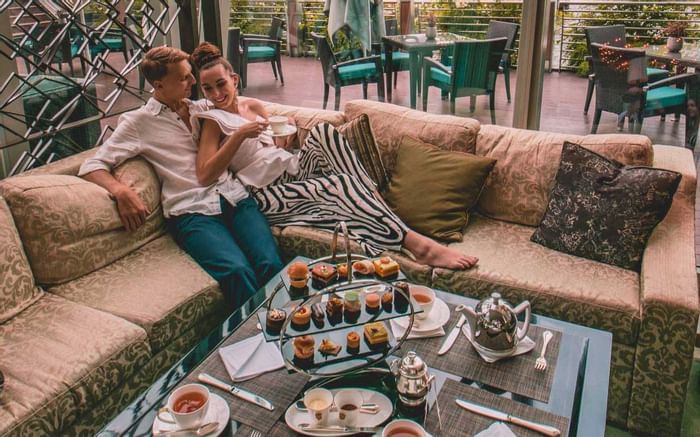 A couple enjoying afternoon tea at Fullerton Bay Singapore