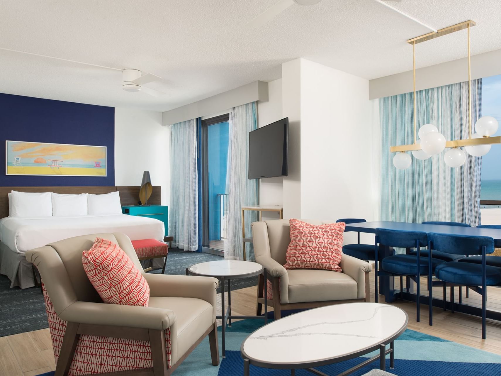 two chairs and a table in a hotel room