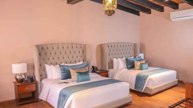 Bedroom arrangement in Junior Suite double at Gamma Hotels