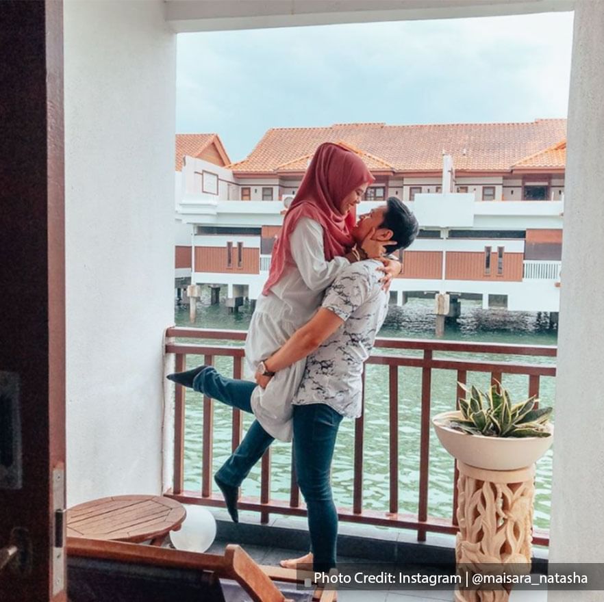 romantic couple enjoying short getaway at beach resort malaysia