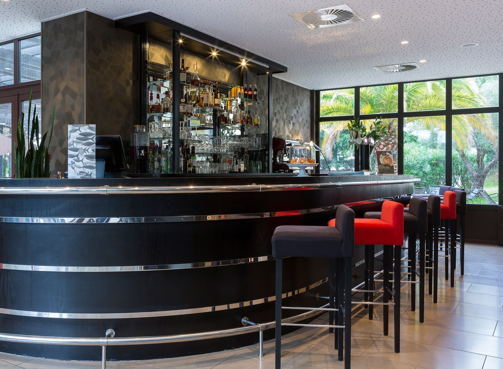 Stools by the counter in the Bar at Oceania Nantes Aéroport