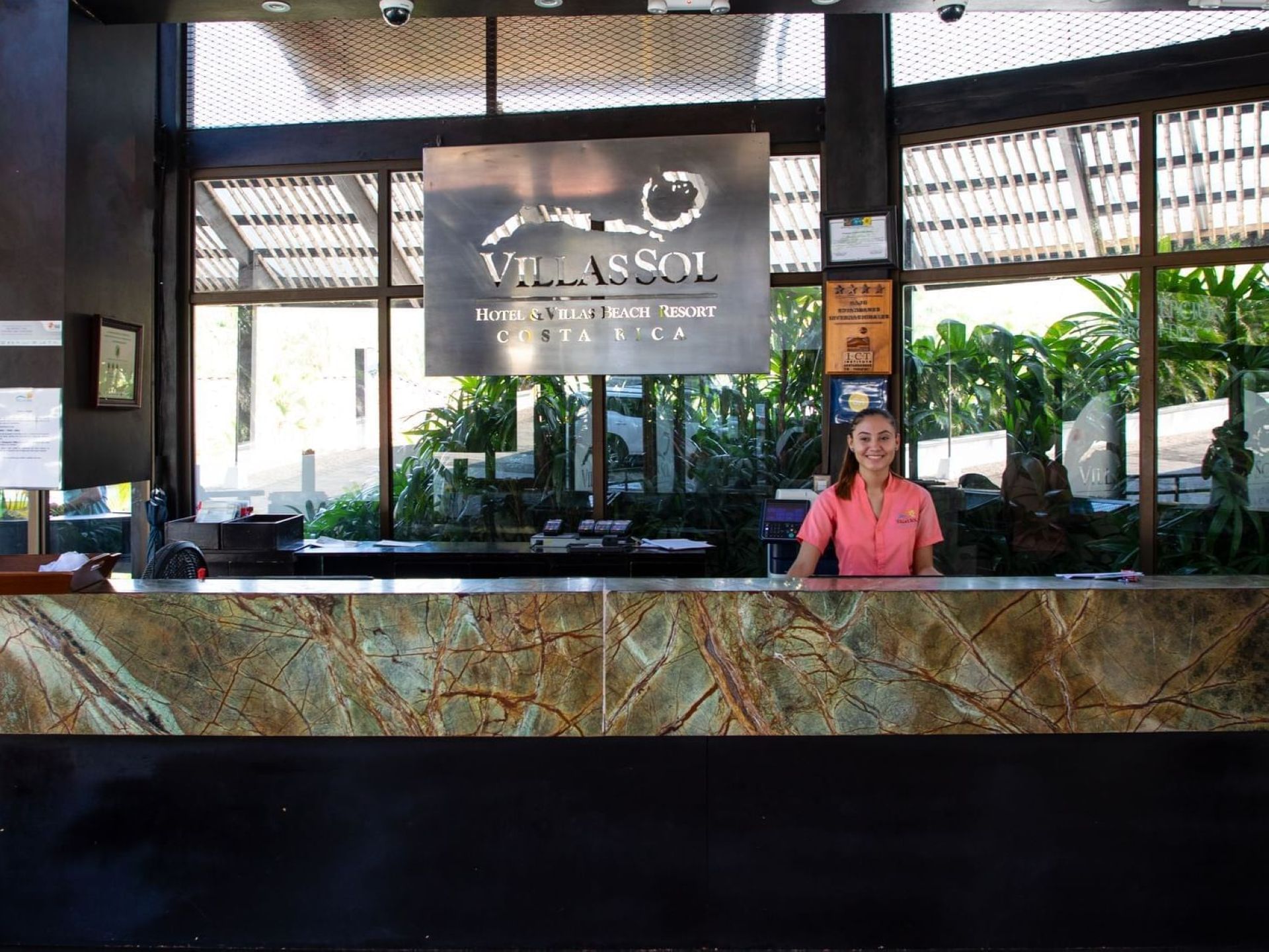 Receptionist in the reception counter area at Villas Sol Beach Resort