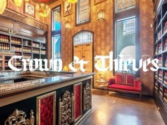 Elaborate winery counter with ornate designs and red accents at Crown & Thieves.