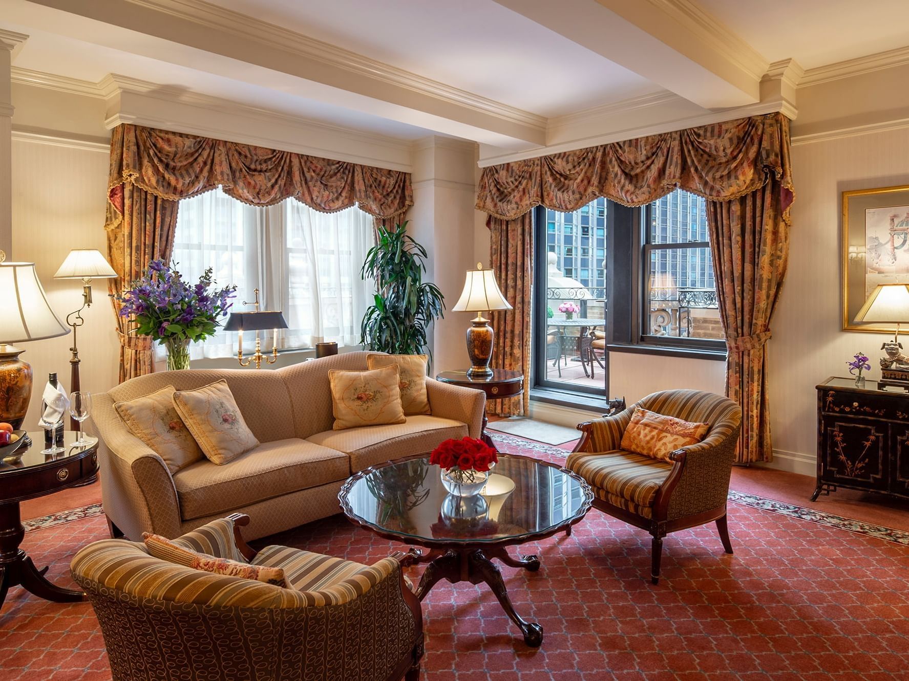 Living room and balcony in Suite of the Stars at Warwick New York