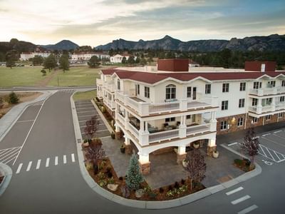 Aerial view of the modern residential suites at The Stanley Hotel property with mountain views