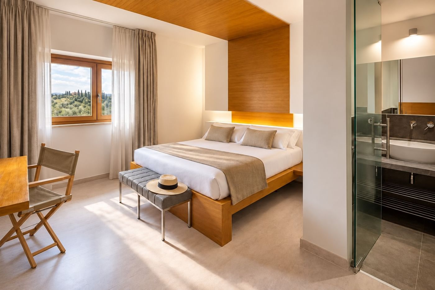 A Montaperti room with warm wood, a king-size bed and countryside views