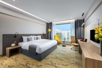 Premier Super King Room with a cozy bed and a working area at Park Hotel Hong Kong