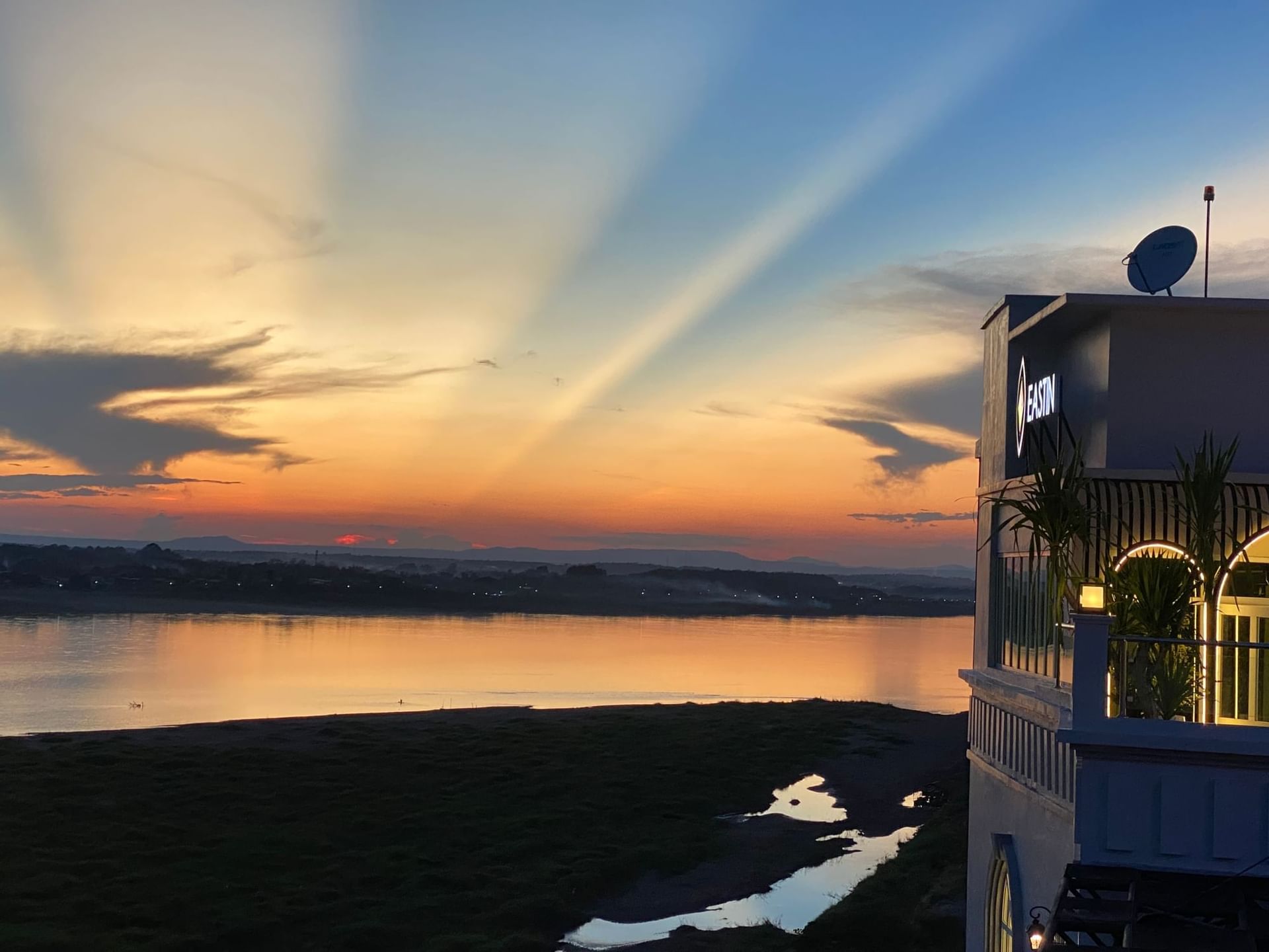 Distant view of the river & hotel at sunset in Eastin Vientiane Laos