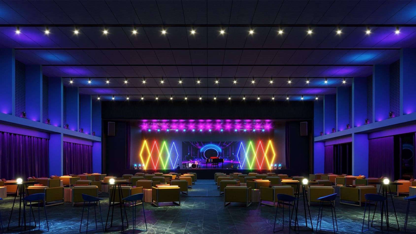 Gran escenario de teatro en Fiesta Americana Funeeq Punta Cana con luces geométricas de neón y asientos cómodos