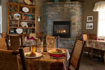 Dinner table with fireplace in the background