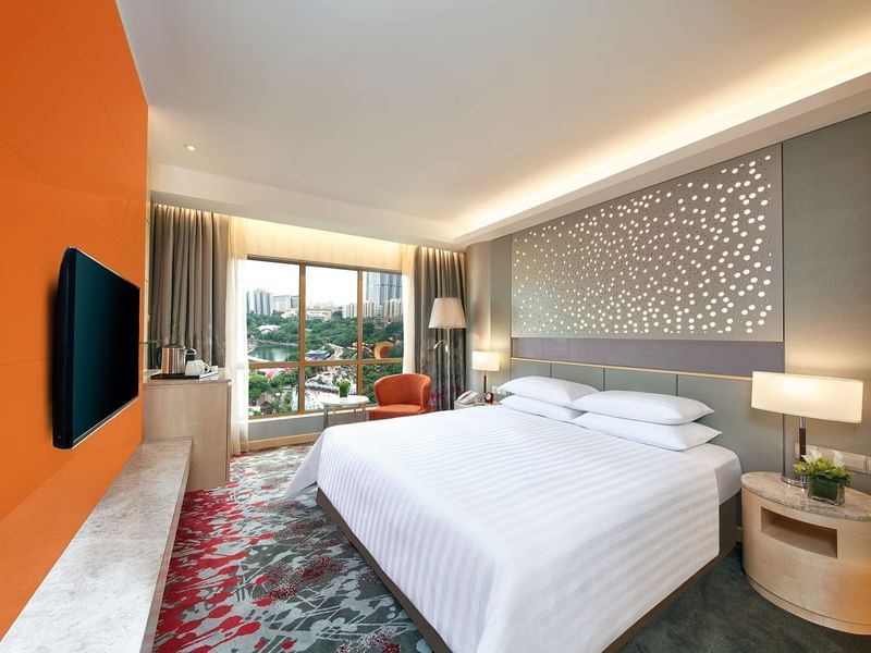 Interior of Deluxe City View King with a panoramic window at Sunway Hotel Hanoi