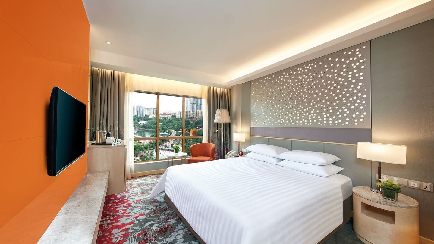 Interior of Deluxe City View King with a panoramic window at Sunway Hotel Hanoi