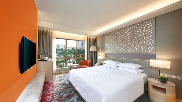 Interior of Deluxe City View King with a panoramic window at Sunway Hotel Hanoi