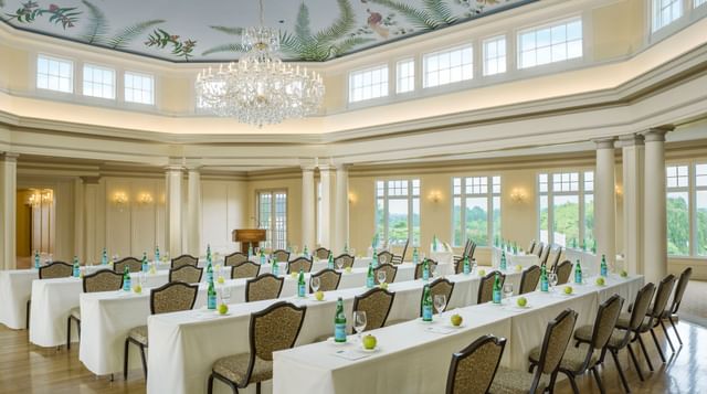 Crystal Ballroom with classroom-style tables under a crystal chandelier near windows at Mountain View Grand Resort & Spa