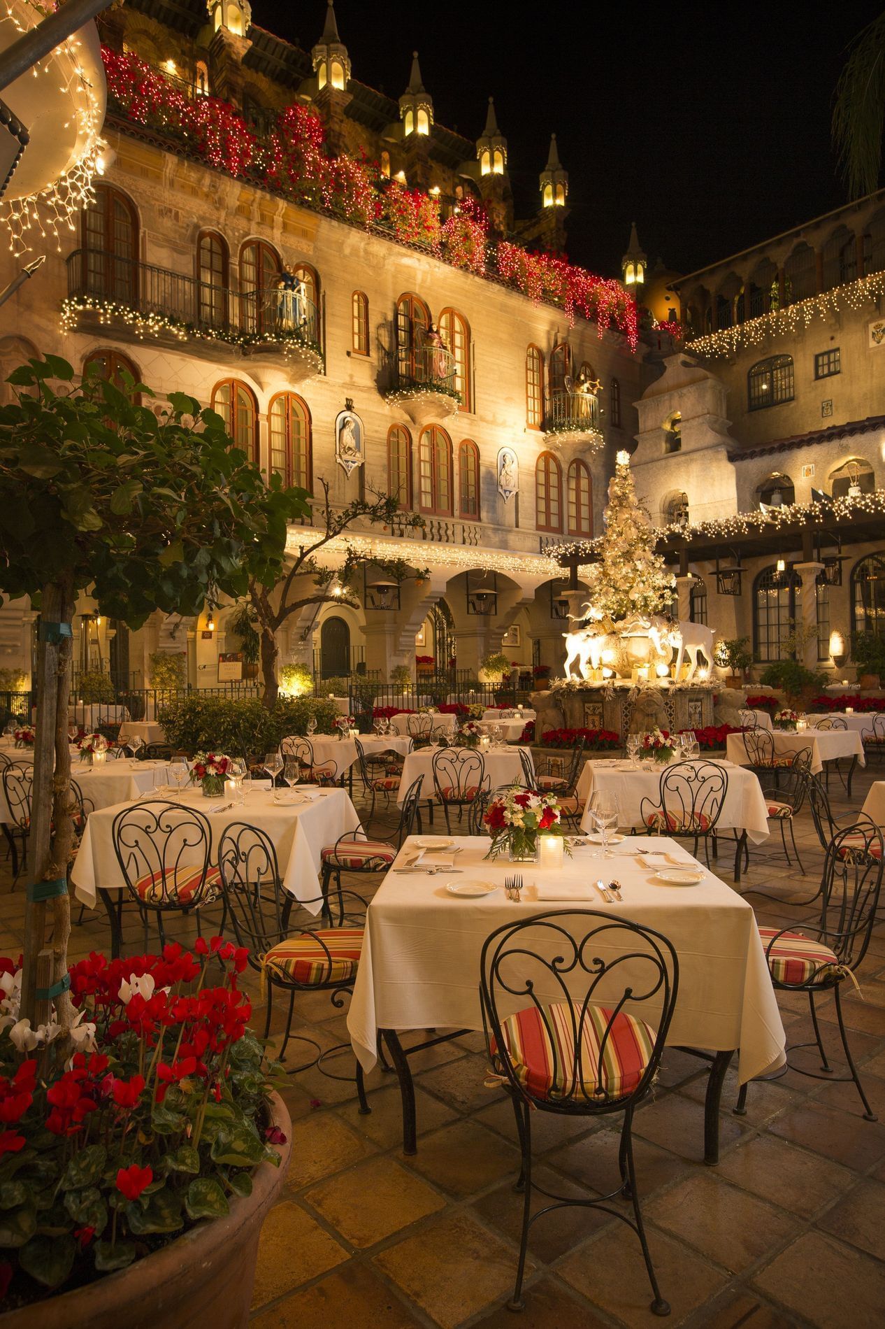 Outdoor patio with tables and chairs at Mission Inn Riverside